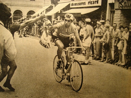 Eddy Merckx grabbing a musette